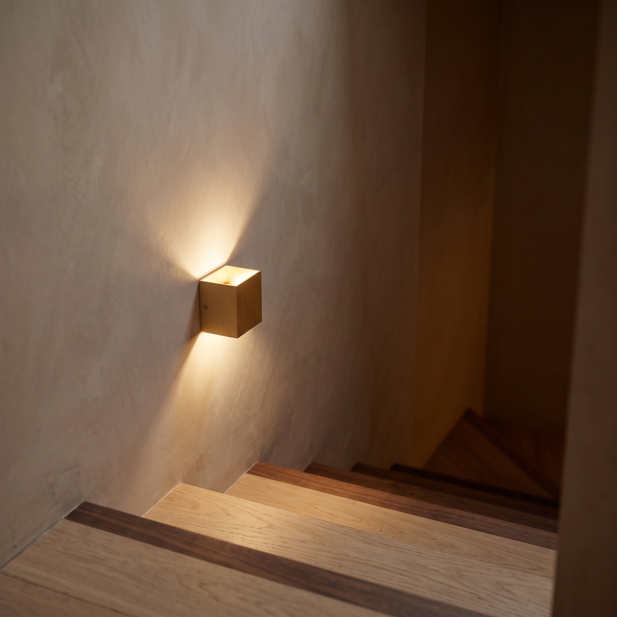 cairn wall light, gold, stairwell