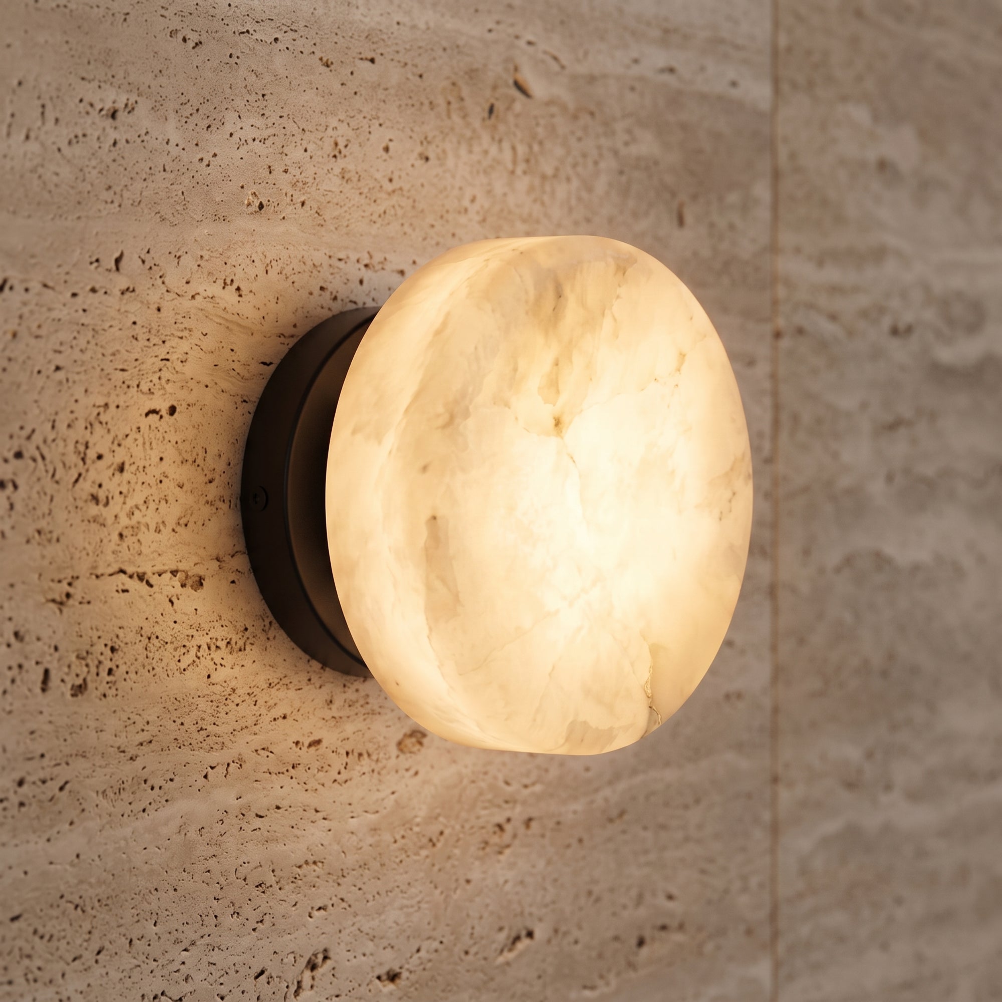 flint wall light, Oval, on a travertine bathroom wall