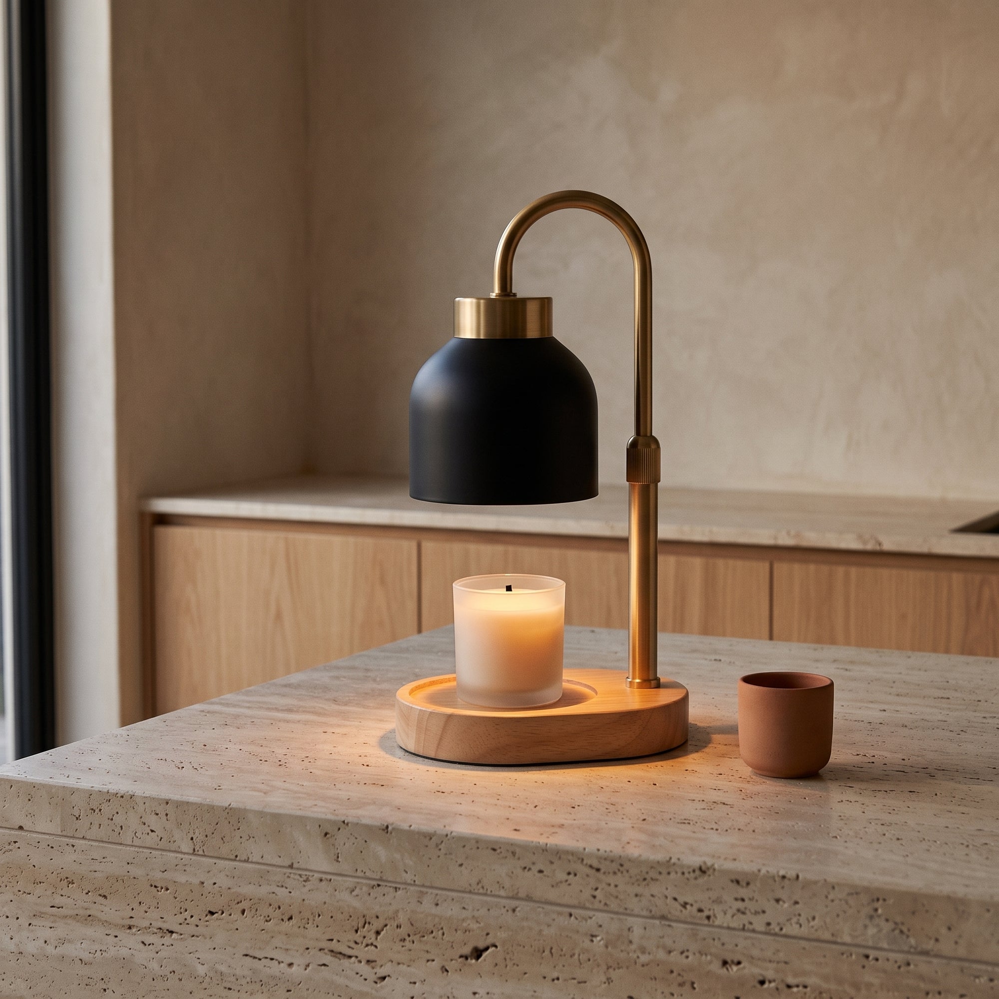 Fen candle warmer, black, on a kitchen benchtop