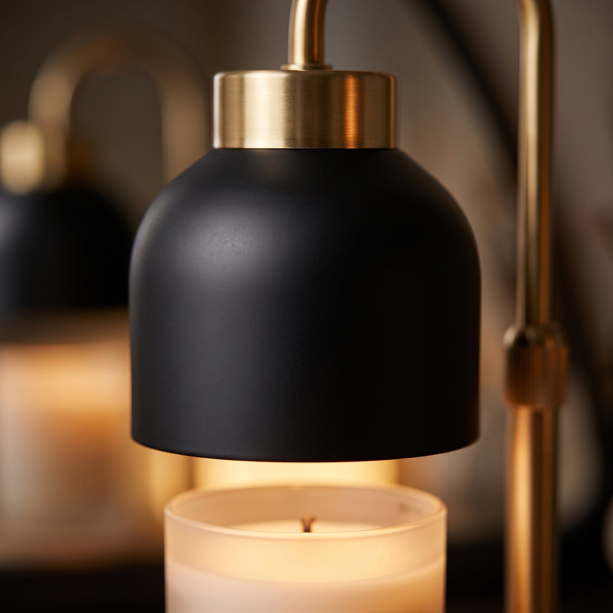 Fen candle warmer, black, macro detail of the dome and brass collar