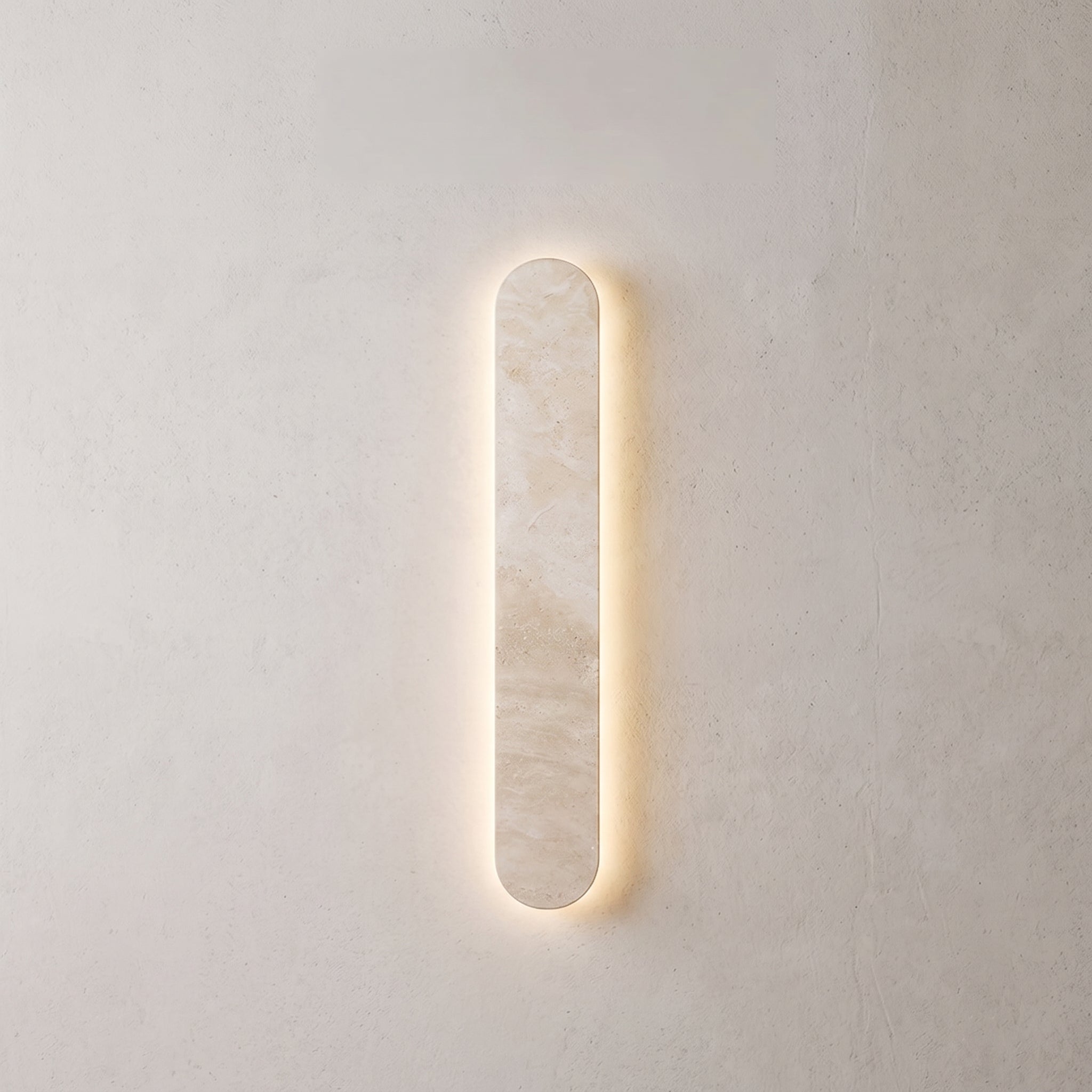 mori wall light, stone-effect capsule wall light with warm LED halo, studio hero