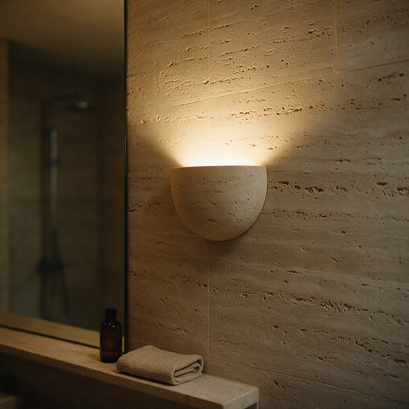 basin wall light on a travertine bathroom wall