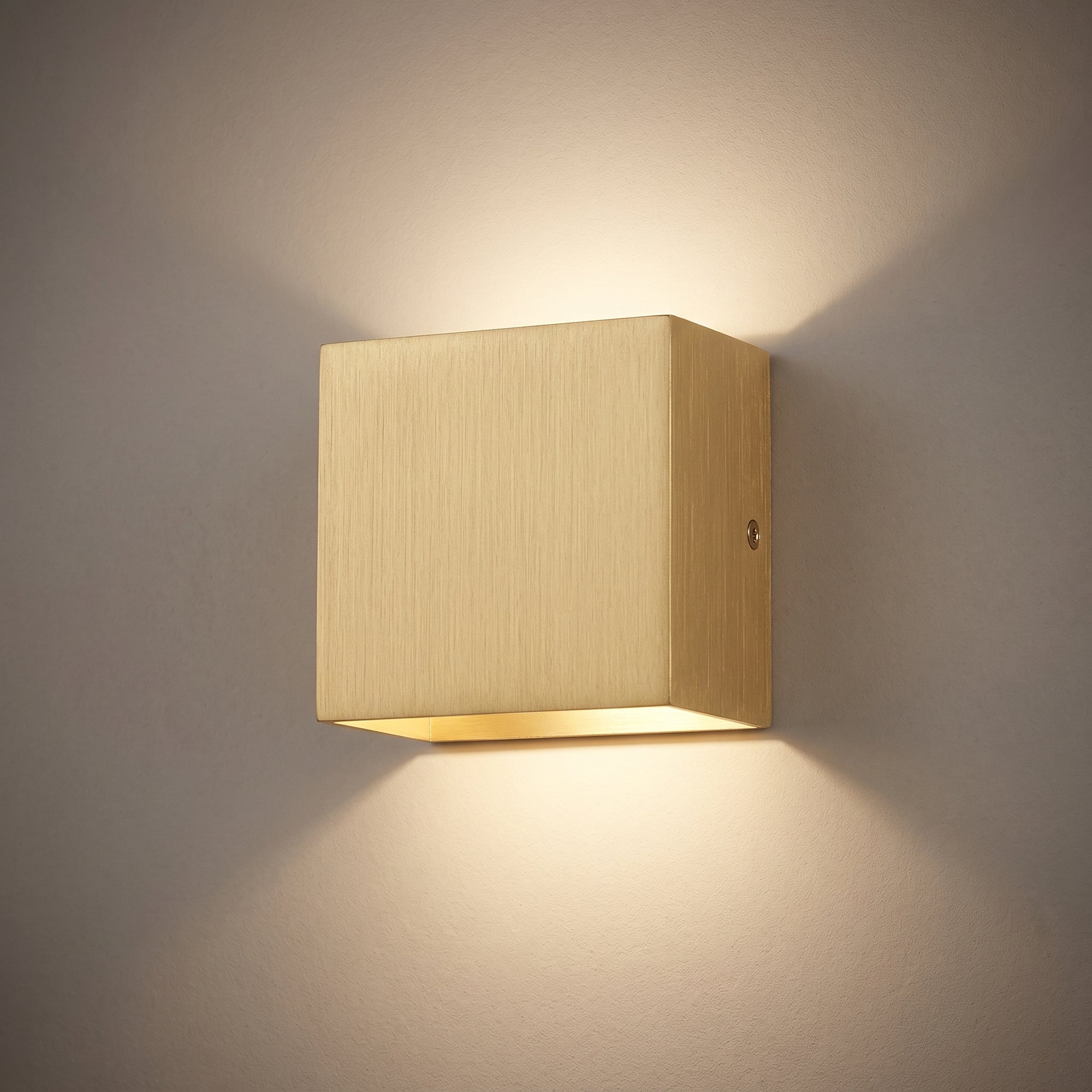 cairn wall light, gold, studio hero