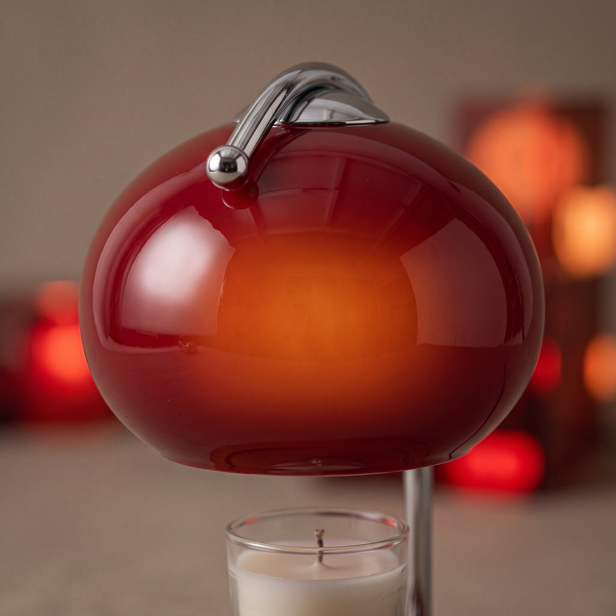 Swale candle warmer, macro detail of the red glass dome