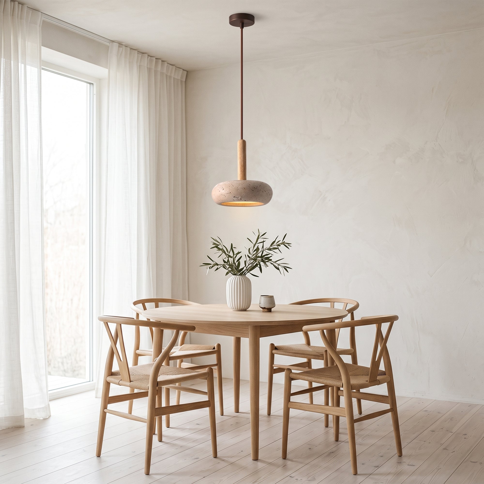 mere pendant light over a Scandinavian oak dining table