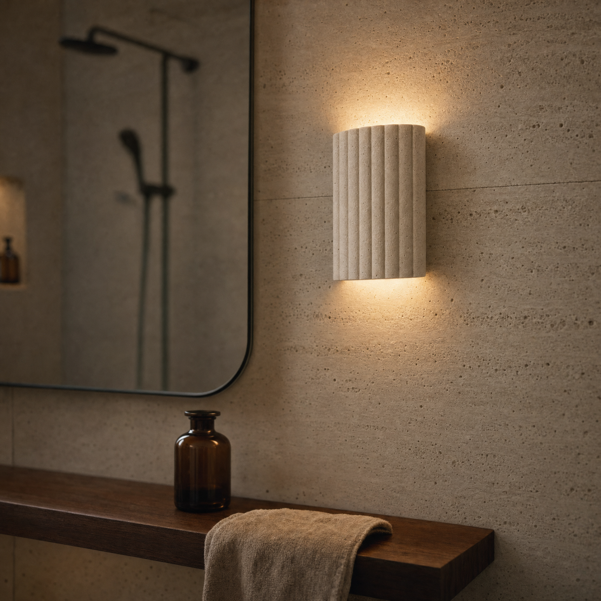 holt wall light in a travertine bathroom