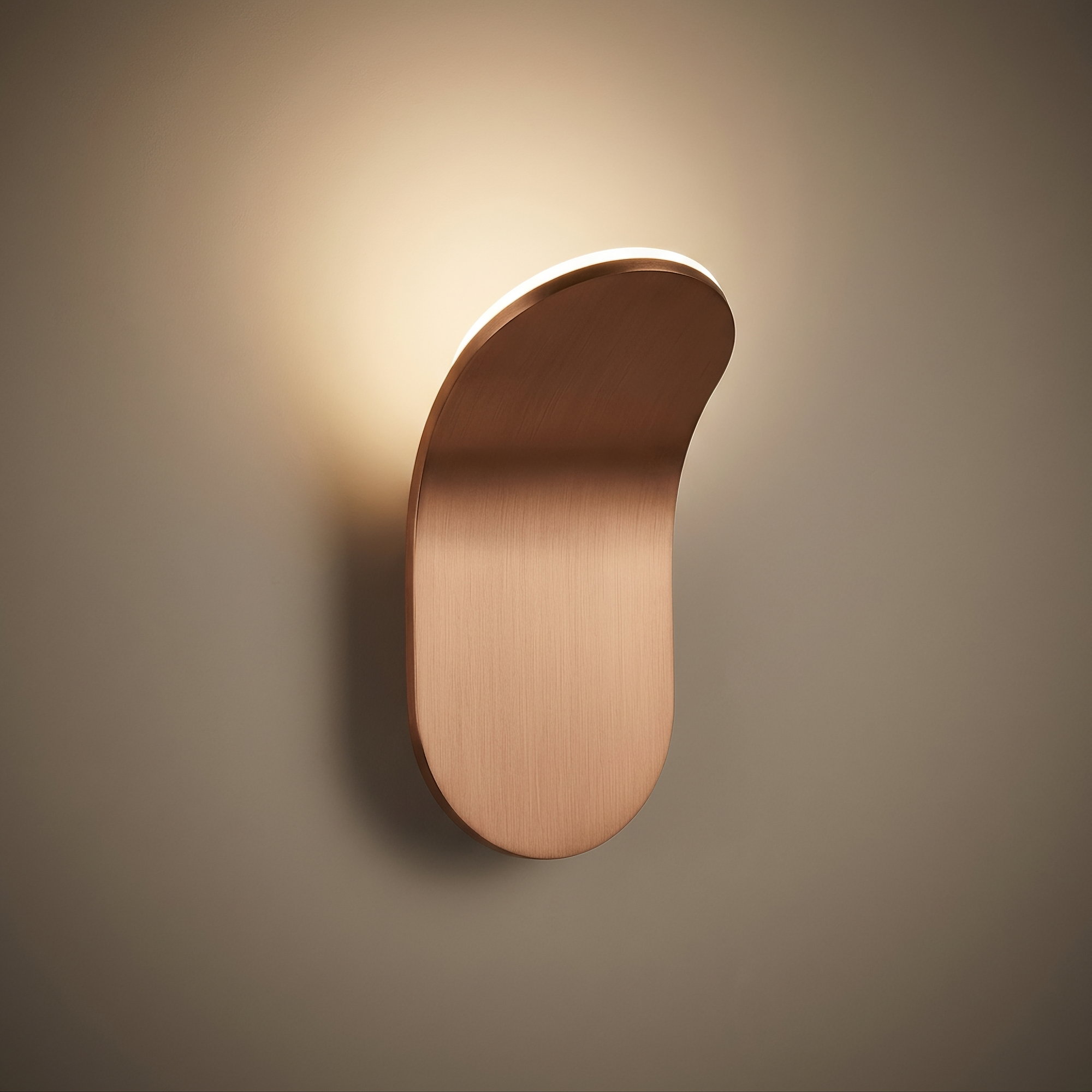 strath wall light, studio hero, brushed copper-tone metal curved wall light with warm integrated glow